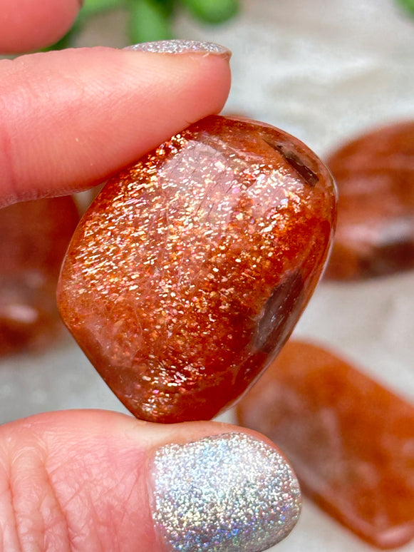 orange-sunstone-tumble-stones