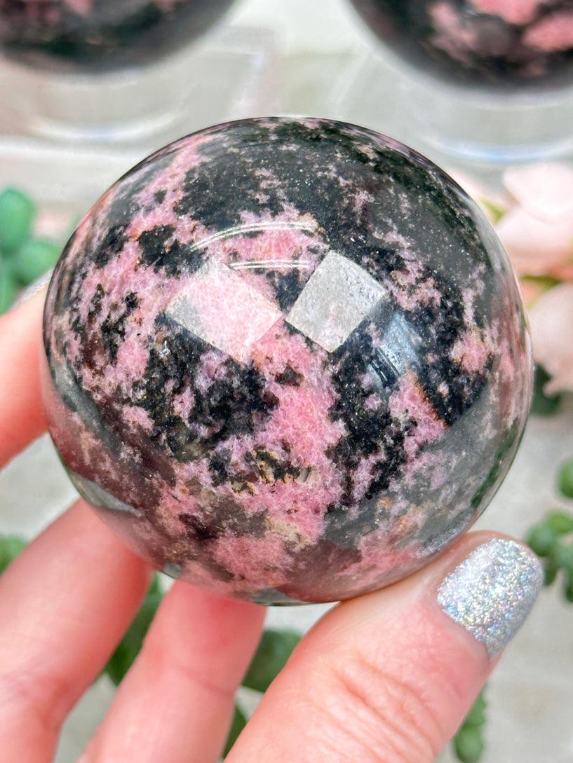 pink-black-rhodonite-sphere