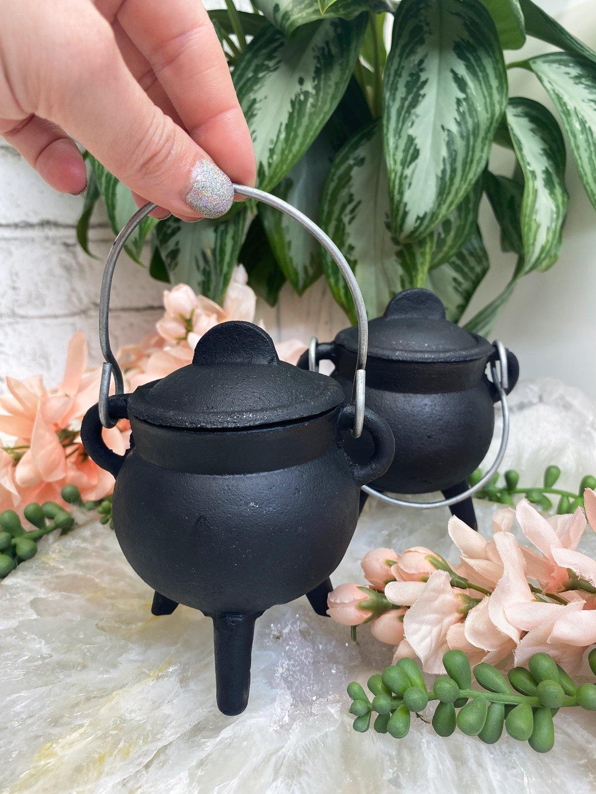 https://contempocrystals.com/cdn/shop/products/Black-Cast-Iron-Cauldron-Pot-for-Burning-Incense-Witchy-Gifts_1024x1024@2x.jpg?v=1679013652