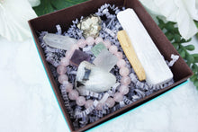 Load image into Gallery: Contempo Crystals - Close up of Crystal Gift Set with Rose Quartz Bracelet, Selenite, Fluorite Octahedrons, Moonstone Tumble, Pyritte Chunk, Quartz Point and a Palo Santo Stick - Image 2