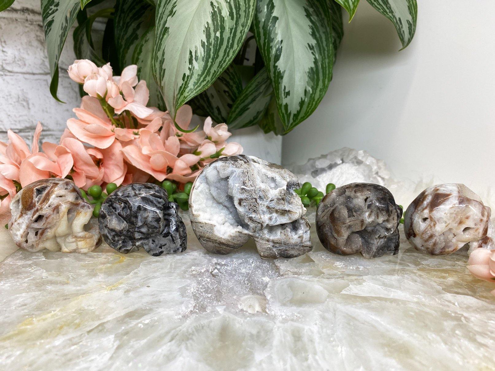 These adorable and unique skull carvings are Druzy Quartz mixed with Sphalerite. side view