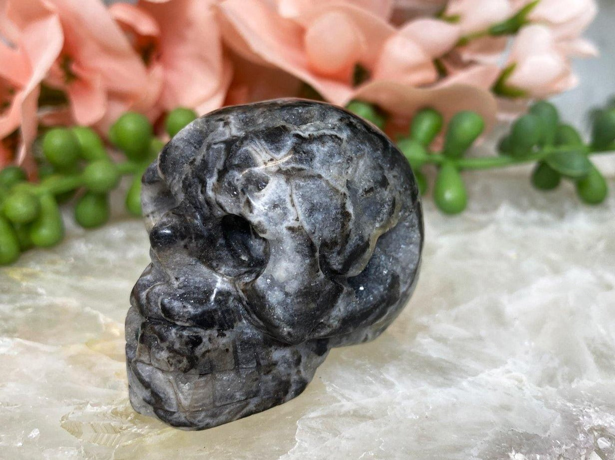 These adorable and unique skull carvings are Druzy Quartz mixed with Sphalerite.