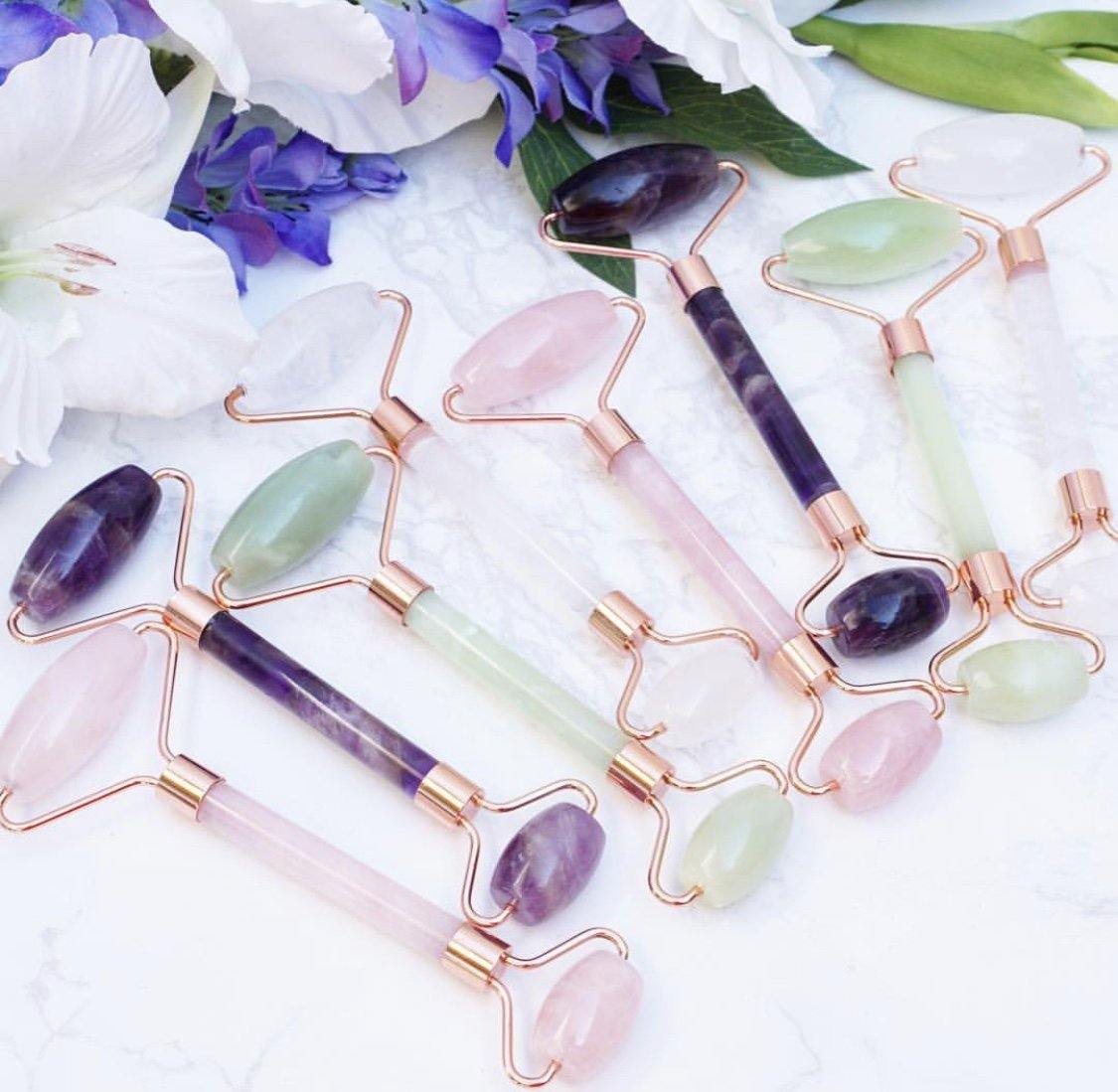 Crystal Face Rollers in Jade, Rose Quartz, Chevron Amethyst, Quartz, Obsidian and Tiger Eye. With rose gold colored metal accenting. 