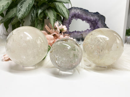 Large clear quartz crystal spheres with hints of inclusions! 