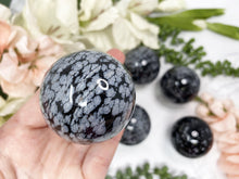Load image into Gallery: Contempo Crystals - Black and white snowflake obsidian sphere. - Image 3