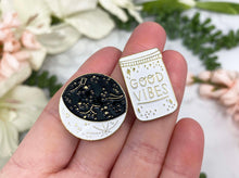Load image into Gallery: Contempo Crystals - Black, White and Gold Moon and Good Vibes Jar Enamel Lapel Pin Set - Image 1