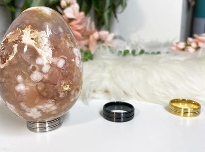 Large flower agate egg with sphere holders in silver gold black