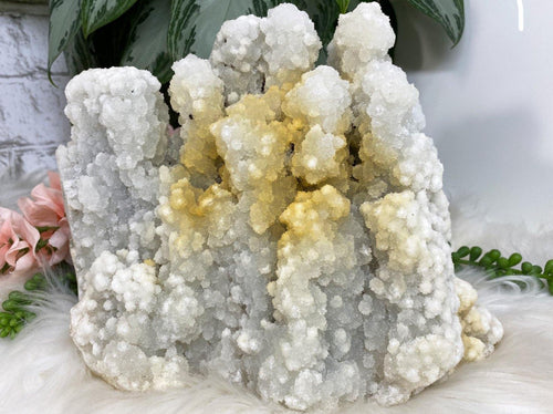Large white apophyllite chalcedony crystal cluster with yellow iron