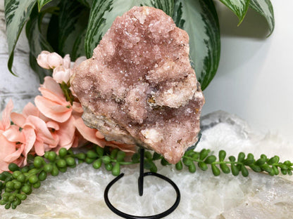 Pink amethyst geode crystal cluster on metal stand