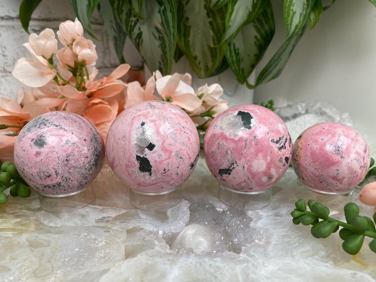 Vibrant-Pink-Rhodonite-Sphere-Crystals-for-Sale