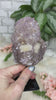 Quality Brazilian amethyst crystal that has actually grown over calcite.  The face also has pieces of calcite showing.  This piece is on a black metal stand (cannot come off).  Very unique piece due to the amethyst growing on the calcite!