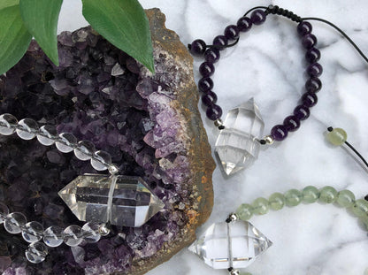 Quartz Point Bracelets featuring a double terminated quartz point full of energy and a drawstring closure. Carry your protective energies everywhere