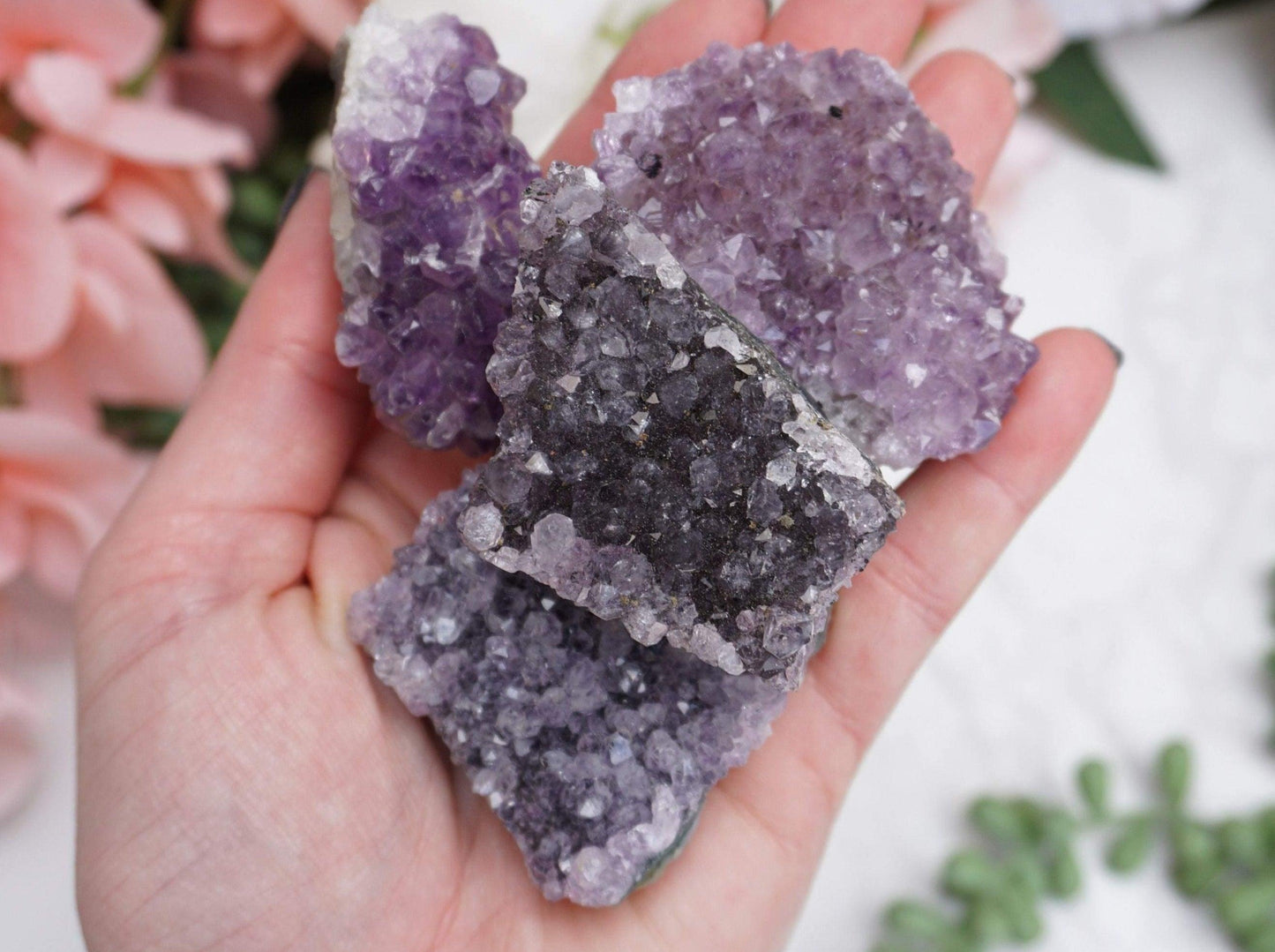 Amethyst Crystal Magnets with beautiful purple front and natural back. Helping to promote a restful night of sleep. Collection of magnets in hand