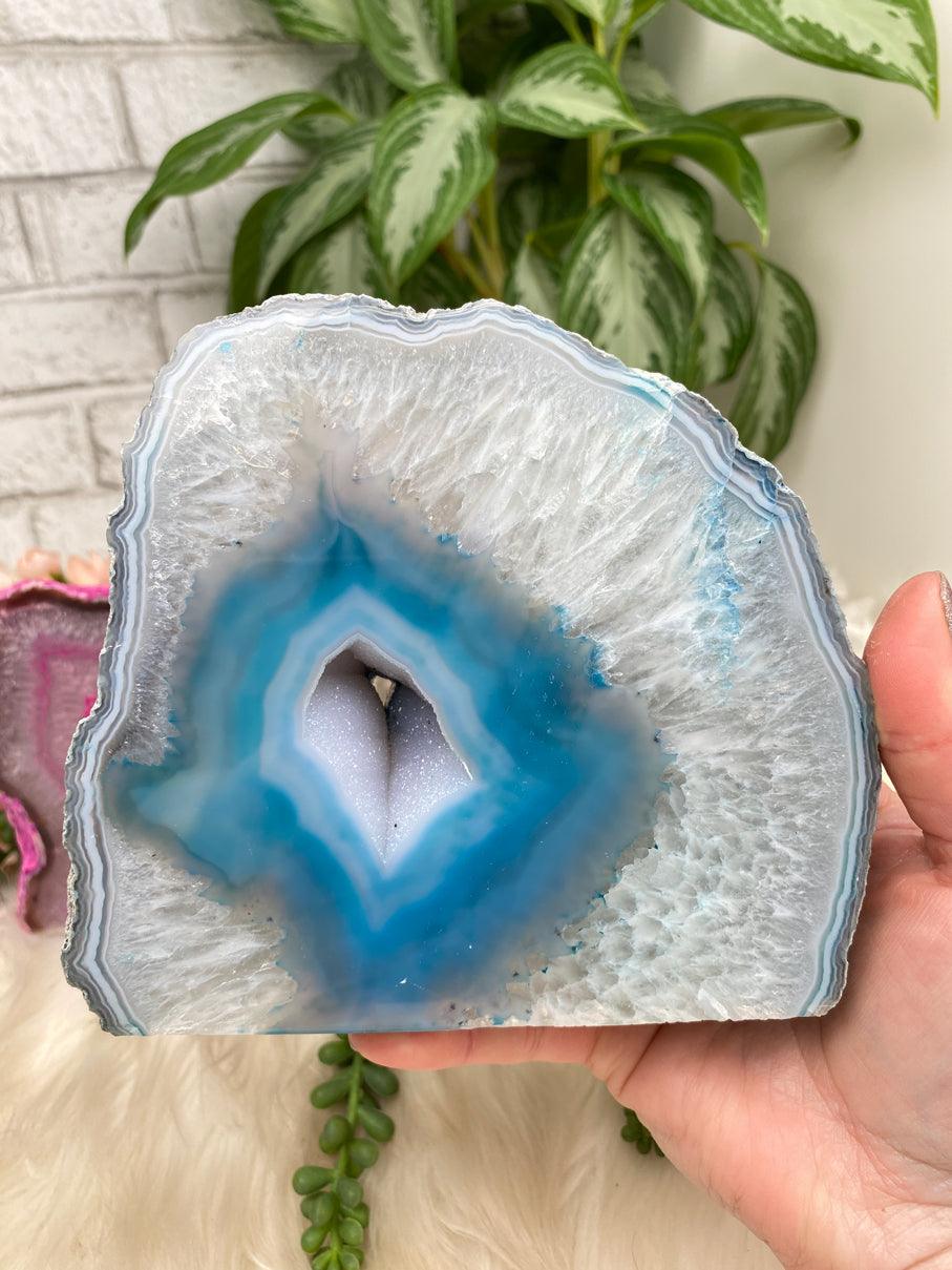 Agate geode with vibrant blue and green crystals on Craiyon